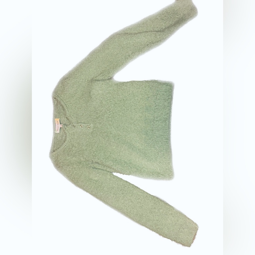 green sweater. cropped.